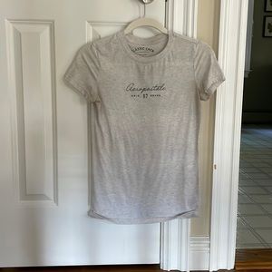 Light grey tight tee shirt.